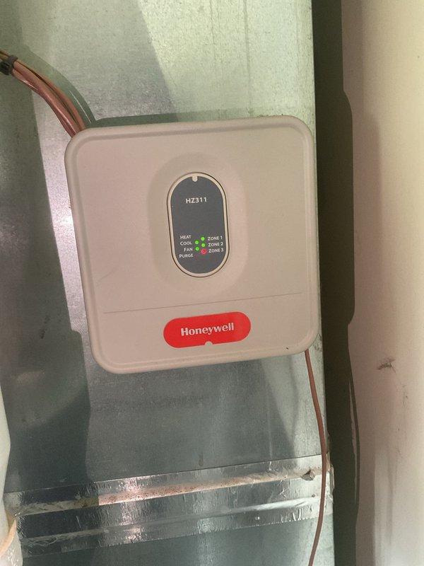 Completed Gold Level planned maintenance on 11-year-old HVAC system. Installed new 20x25x4 air filter, inspected Honeywell HZ311 zone control panel with multi-zone functionality showing proper operation across all three zones, and verified system components including water heater plumbing connections and PVC piping for proper installation and condition.