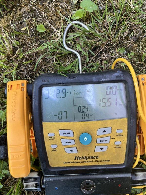 Conducted follow-up site visit to inspect mini-split system and verify replacement parts prior to scheduled installation. Photographed equipment specifications and model information on new mini-split indoor heads, confirmed part numbers match work order requirements. Utilized refrigerant manifold gauge set to assess system operating parameters and document baseline readings for upcoming replacement of all indoor heads and outdoor condensing unit.