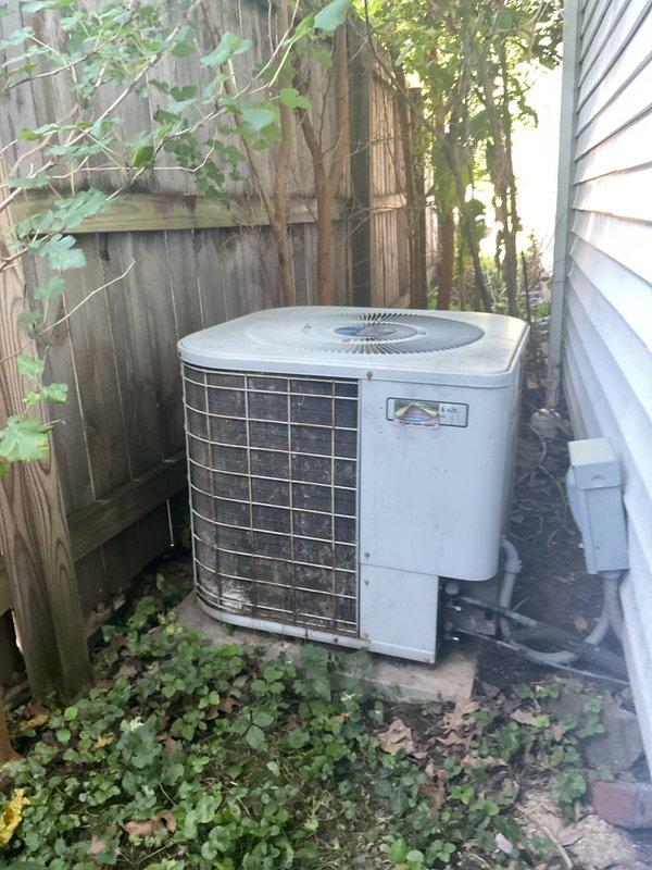 Conducted comprehensive replacement estimate for 23-year-old residential HVAC system. Evaluated existing outdoor condensing unit located in side yard between house and wooden fence, noting unit positioned on concrete pad with adequate clearance. Assessed current system configuration including downflow air handler setup with existing furnace, evaporator coil, and base components. Documented equipment dimensions and spatial constraints for replacement planning, including 40-foot refrigerant line set routing from outdoor unit to indoor air handling equipment. Photographed existing installation conditions and created technical schematic showing proposed vertical equipment configuration with color-coded component layout. Provided homeowner with detailed replacement options and specifications for new system installation to address aging equipment concerns.