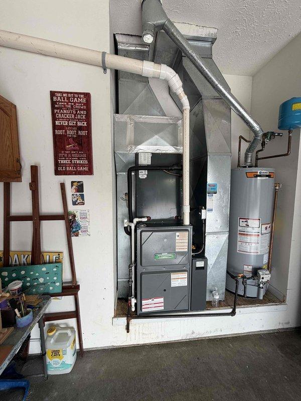 Responded to water leak issue at residential HVAC system and diagnosed failed coil drain pan requiring replacement. Documented equipment model and serial number information, photographed damaged pan and system configuration for warranty part ordering. Determined repair will require two technicians to attempt pan replacement without opening refrigerant system, with completion time dependent on accessibility of coil pan assembly.