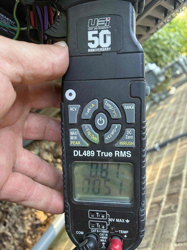 Completed scheduled HVAC system tune-up and maintenance as part of planned service campaign. Performed comprehensive system diagnostics using professional-grade testing equipment including UEi DL489 True RMS meter and Klein Tools temperature measurement device to verify electrical parameters and operational temperatures. All readings documented photographically, with system operating within normal specifications at 5.1 degrees temperature differential, confirming proper refrigerant charge and airflow performance.