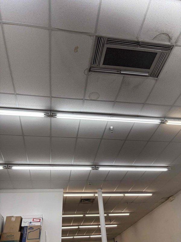 Responded to no-cooling complaint at commercial retail facility with three rooftop HVAC units, one of which was inoperative in the customer shopping area. Accessed rooftop equipment using extension ladder with two-technician safety protocol due to building height and access requirements. Performed diagnostic evaluation on non-functioning rooftop unit serving retail space, identifying system age at 10+ years. Documented ceiling-mounted supply diffuser and return grille locations within affected zone showing signs of inadequate air circulation. Provided repair versus replacement options assessment given unit age and building lease timeframe, with photographic documentation of equipment condition and site access requirements for future reference.