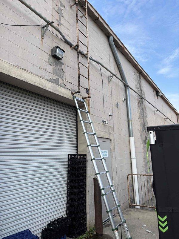 Responded to no-cooling complaint at commercial retail facility with three rooftop HVAC units, one of which was inoperative in the customer shopping area. Accessed rooftop equipment using extension ladder with two-technician safety protocol due to building height and access requirements. Performed diagnostic evaluation on non-functioning rooftop unit serving retail space, identifying system age at 10+ years. Documented ceiling-mounted supply diffuser and return grille locations within affected zone showing signs of inadequate air circulation. Provided repair versus replacement options assessment given unit age and building lease timeframe, with photographic documentation of equipment condition and site access requirements for future reference.