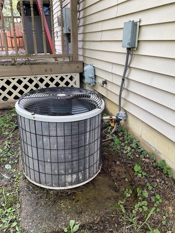Responded to no cooling complaint on 10-year-old residential air conditioning system. Upon arrival, performed comprehensive diagnostic evaluation of both indoor air handler unit located in utility closet and outdoor condenser unit. Verified no ice buildup present on evaporator coil or refrigerant lines at indoor unit. Inspected outdoor condenser unit positioned on concrete pad against exterior wall, noting proper drainage and clear airflow around unit. Conducted system operational testing, checked refrigerant pressures, evaluated electrical connections at disconnect box, and assessed overall equipment performance. Documented equipment condition with photographic records of both indoor and outdoor components for service history.