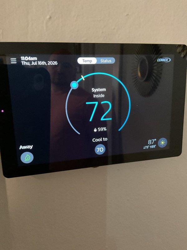 Responded to cooling complaint on 1-year-old Lennox system struggling to maintain setpoint. Upon arrival, found thermostat calling for cooling with indoor temperature at 72°F and setpoint at 70°F, while outdoor temperature was 87°F. Inspected outdoor condensing unit and confirmed proper operation of compressor and condenser fan. Checked refrigerant pressures, airflow, and electrical connections. System operating within manufacturer specifications. Advised customer that unit is functioning properly but may experience extended run times during peak outdoor temperatures, which is normal for the equipment size and ambient conditions. No repairs required at this time.