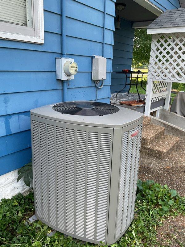 Responded to cooling complaint on 1-year-old Lennox system struggling to maintain setpoint. Upon arrival, found thermostat calling for cooling with indoor temperature at 72°F and setpoint at 70°F, while outdoor temperature was 87°F. Inspected outdoor condensing unit and confirmed proper operation of compressor and condenser fan. Checked refrigerant pressures, airflow, and electrical connections. System operating within manufacturer specifications. Advised customer that unit is functioning properly but may experience extended run times during peak outdoor temperatures, which is normal for the equipment size and ambient conditions. No repairs required at this time.