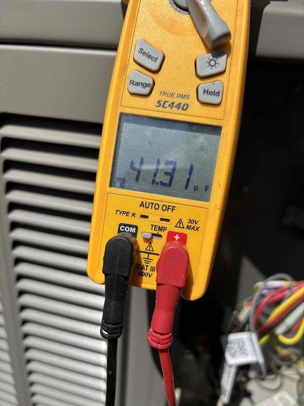 Completed planned HVAC maintenance inspection, reviewing 16x20x5 filter that has been in service for 3 years with monthly monitoring protocol. Performed diagnostic measurements using digital multimeter at system grille, recording electrical readings of 4131, and documented supply air temperature of 58°F using calibrated digital thermometer to verify proper system operation and airflow performance.