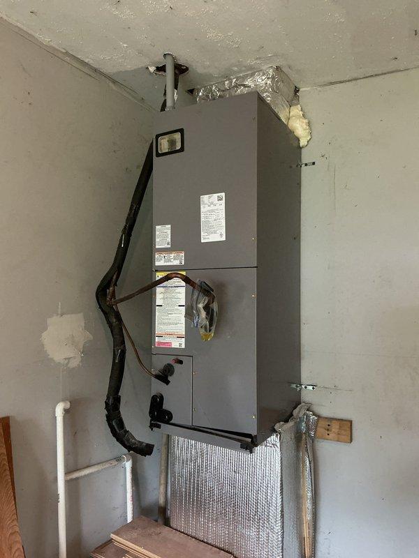 Responded to no-cooling service call for recently purchased home. Upon arrival, conducted thorough assessment of wall-mounted air handler unit and outdoor condenser unit. Confirmed system was not operational due to incomplete installation by previous owners. Evaluated electrical connections, refrigerant line sets, condensate drainage, and control wiring between indoor and outdoor units. Documented existing equipment configuration including ductwork connections and electrical disconnect. Provided homeowner with detailed assessment of required work to properly connect and commission the HVAC system for operational status.