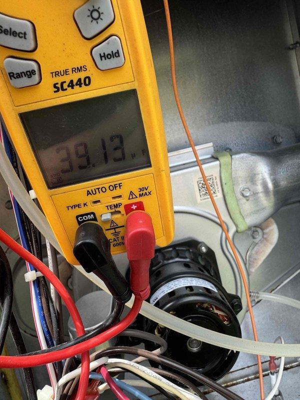 Completed annual planned maintenance on 9-month-old packaged HVAC unit during second visit as requested near end of day. Performed comprehensive system inspection with access panel removed, tested electrical components including amperage readings at 39.13 amps using digital multimeter, verified proper operation of motor and capacitor, inspected refrigerant lines and connections, and replaced 20x20x5 air filter per maintenance schedule.