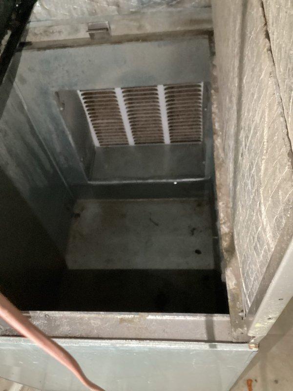 Responded to emergency service call for active water leak from central HVAC system flowing onto kitchen floor. Upon arrival, accessed unit through basement crawl space and inspected condensate drainage system. Found primary condensate drain line completely blocked, causing overflow from drain pan. Cleared obstruction from condensate line using appropriate tools and verified proper drainage flow. Inspected drain pan for cracks or damage and confirmed structural integrity. Tested system operation to ensure condensate was draining correctly without backup. Cleaned accumulated debris from affected areas and verified no further leakage present during extended run cycle.