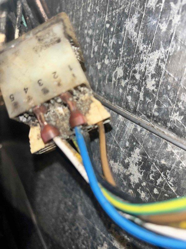 Responded to no cooling complaint on 15-year-old heat pump system. Upon arrival, performed diagnostic evaluation of outdoor unit and indoor components. Identified deteriorated electrical connections at outdoor unit with visible weathering and compromised wiring integrity on junction box. Inspected thermostat operation showing 87°F indoor temperature against 72°F setpoint with cooling mode engaged. Assessed compressor operation, refrigerant circuit, and electrical supply to condenser unit. Documented equipment condition with photos showing extensive weathering on outdoor unit mounting surface and electrical connection points requiring attention. System evaluated for age-related component degradation and cooling capacity performance.