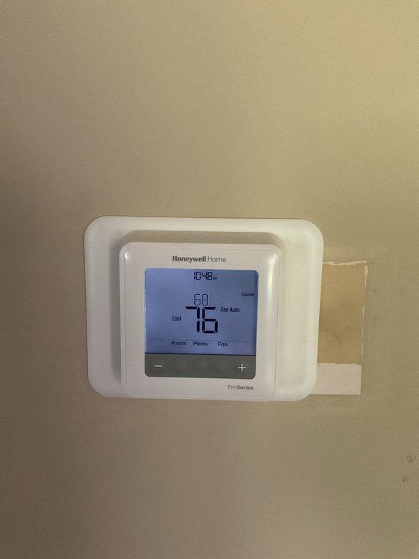 Responded to no cooling complaint on downstairs 5-year-old residential split system. Upon arrival, verified thermostat set to cooling mode at 76°F with system running but inadequate cooling to conditioned space. Proceeded to outdoor condensing unit and performed comprehensive system diagnostics using refrigerant manifold gauges and digital analyzer. Measured refrigerant pressures on both low and high side to assess system charge and performance parameters. Evaluated compressor operation, condenser fan motor function, and airflow across coil. System diagnostics revealed operational deficiency requiring further assessment of refrigerant charge levels and overall cooling capacity to restore proper temperature control to affected zone.