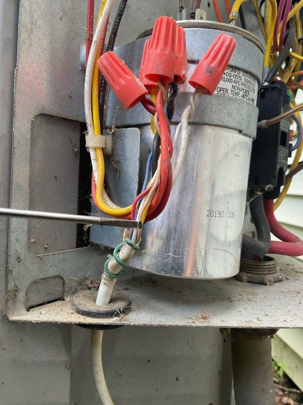 Responded to callback for downstairs HVAC unit with complete loss of power, previously serviced on 6/23. Upon arrival, confirmed upstairs unit operational and no electrical service interruptions or tripped breakers. Inspected downstairs unit and identified failed capacitor preventing system startup. Removed defective capacitor and installed new replacement unit with proper MFD rating and voltage specifications. Verified all electrical connections secure with wire nuts and proper color-coded wiring intact. Tested system operation and confirmed unit restored to full functionality with proper amperage draw and normal operating temperatures.