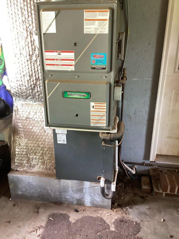 Responded to no cooling call on 8-year-old residential HVAC system. Upon arrival, confirmed indoor unit blowing warm air with outdoor condenser not responding. Verified no frozen coils or tripped breakers present. Inspected basement-mounted furnace cabinet and filter housing. Found 20x20x4 air filter in place with moderate dust accumulation. Diagnosed outdoor unit failure to energize as primary issue preventing cooling operation. Documented equipment condition and filter status with photos for service records.
