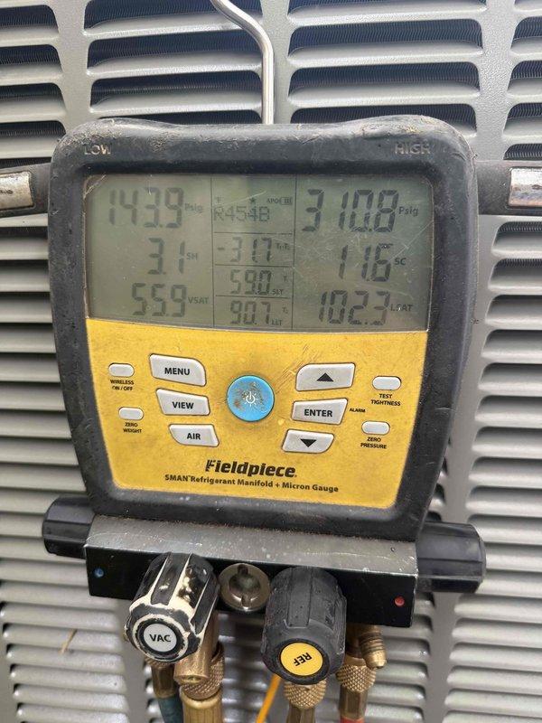 Completed installation of 3-ton, 14.7 SEER Lennox air conditioning system with matching evaporator coil in side yard location. Unit was properly positioned on concrete pad with adequate clearance, refrigerant lines were connected and charged to manufacturer specifications as verified by manifold gauge readings, and system was tested for proper operation with pressures stabilized at 439 PSIG high side and 310.8 PSIG low side with corresponding temperatures confirming correct refrigerant charge.