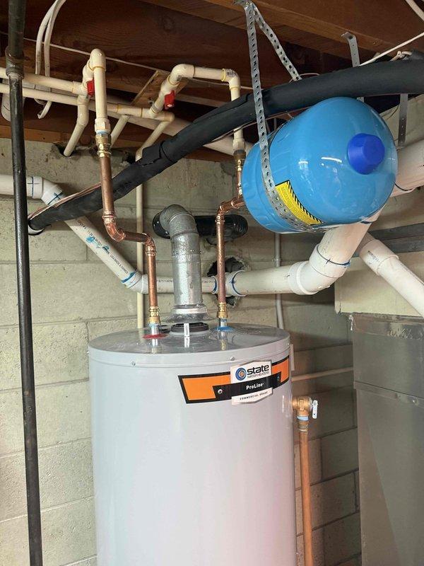 Completed installation of 3-ton, 23.5 SEER heat pump system with 99% AFUE upflow gas furnace, including iWave air purification system with polarized filtration technology. Installed 50-gallon State Industries natural gas automatic storage water heater (Model 1600) with expansion tank, complete copper and PVC supply plumbing, red-handled shut-off valves, and proper venting in accordance with CSA/ANSI Z21.10.1/CSA 4.1-2019 standards. All systems tested, operational, and performing to manufacturer specifications.