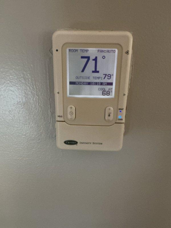 Responded to water leak complaint at Carrier HVAC system. Upon inspection, identified moisture issue originating from evaporator coil and filter area of vertical air handler unit. Examined refrigerant lines, condensate drainage system, and coil housing for source of leak. Cleared condensate drain line obstruction, verified proper drainage flow, and confirmed system operation. Tested unit through full cooling cycle to ensure leak was resolved and all components functioning properly.