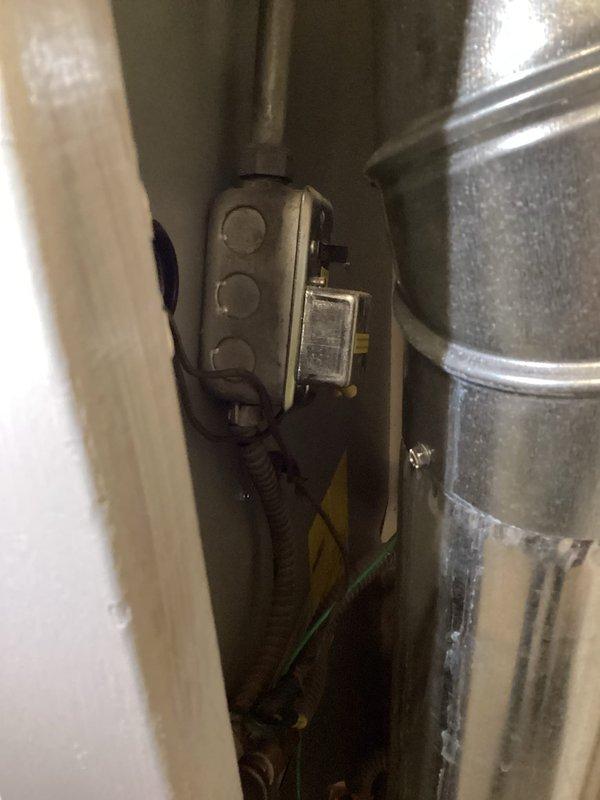 Conducted comprehensive on-site estimate for tankless gas water heater installation. Evaluated existing A.O. Smith ProMax tank-style water heater and associated plumbing infrastructure, including copper supply lines, gas connections, and venting system. Assessed current ductwork condition, noting deterioration and mineral deposits on galvanized venting components. Documented electrical controls, mechanical systems integration, and utility room configuration to determine optimal placement and requirements for tankless conversion. Photographed existing installation, pipe routing, and structural considerations necessary for proper sizing and specification of new tankless gas unit.