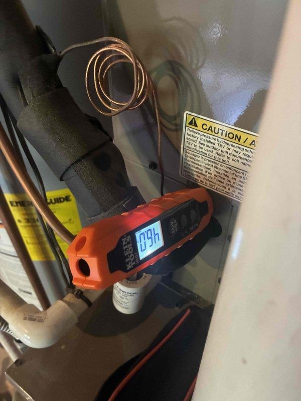 Responded to no cooling complaint on residential HVAC system less than 10 years old. Upon arrival, confirmed system was cycling but maintaining inadequate temperature approximately 5 degrees above setpoint with airflow present but not cooling properly. Performed diagnostic testing and measured refrigerant subcooling at 9.4 degrees and supply air temperature at 65.8 degrees, indicating insufficient cooling capacity. System evaluation revealed performance issues requiring further assessment of refrigerant charge levels and cooling circuit operation to restore proper cooling function.