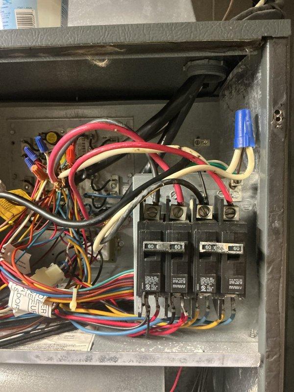 Responded to no cooling call on 15-year-old Amana air conditioning system. Upon arrival, confirmed indoor blower operational but outdoor unit not running. Inspected electrical panel and found tripped 60-amp breaker supplying power to condensing unit. Reset breaker and verified system returned to normal operation with outdoor unit running and proper cooling restored. Thermostat displaying 79 degrees at time of service, system cycling properly after repair.