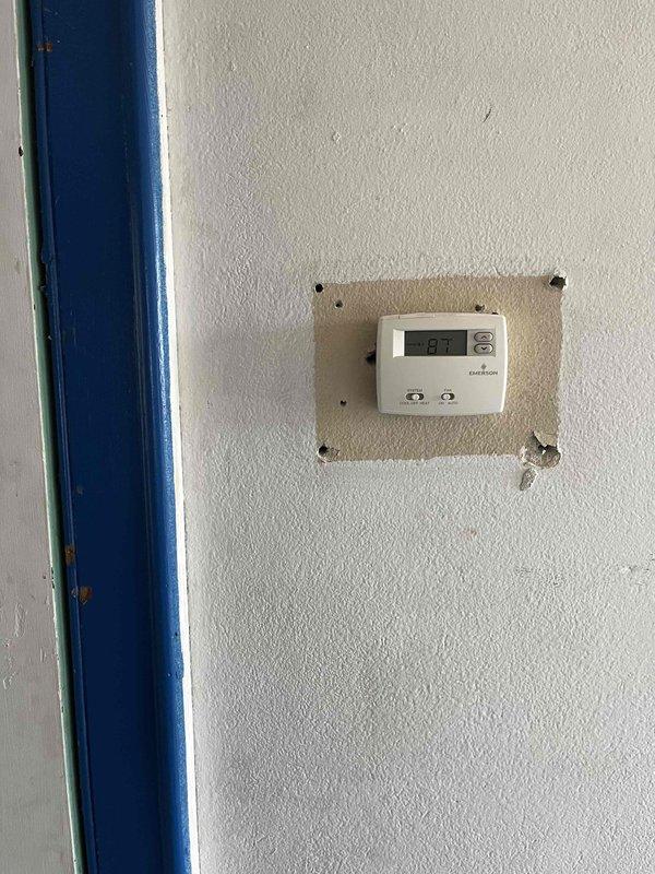Conducted comprehensive replacement estimate for non-operational HVAC system at residential property. Performed detailed measurements of existing air handler unit, documented current equipment condition including refrigerant lines and electrical components, and assessed thermostat functionality showing 67-degree reading on Emerson digital control. Provided homeowner with complete system replacement options and recommendations based on equipment age, visible wear patterns, and operational failure.