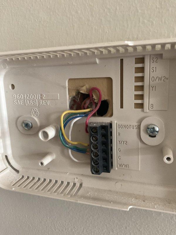 Responded to service call for non-functional downstairs air conditioning system. Upon arrival, evaluated 22-year-old HVAC system including Carrier furnace and air handler assembly located in interior utility closet. Inspected thermostat wiring configuration and documented existing equipment condition through comprehensive photography of system components, wiring terminals, and installed hardware. Prepared detailed replacement estimate for complete HVAC system upgrade due to age and operational failure of existing equipment.