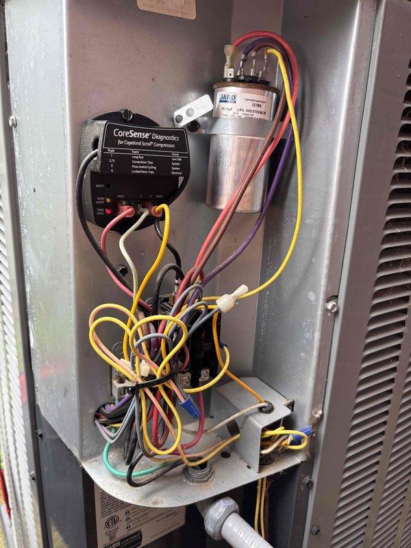 Completed Platinum Level planned maintenance on a 6-year-old single-system HVAC unit during the second annual visit. Performed comprehensive inspection of all major components including the outdoor unit's electrical control panel, CoreSense diagnostic module, capacitor, and wiring connections. Examined the indoor air handler assembly, verifying proper operation of the heat exchanger coils, drainage system with PVC piping, and refrigerant line connections. Replaced 16x20x5 air filter as part of routine maintenance protocol. Documented system condition through photographic records showing electrical components, control systems, heat exchanger assembly with aged copper tubing exhibiting normal oxidation patterns, and drainage pan. All components found operating within normal parameters with no immediate service needs identified. System cleared for continued operation until next scheduled maintenance interval.