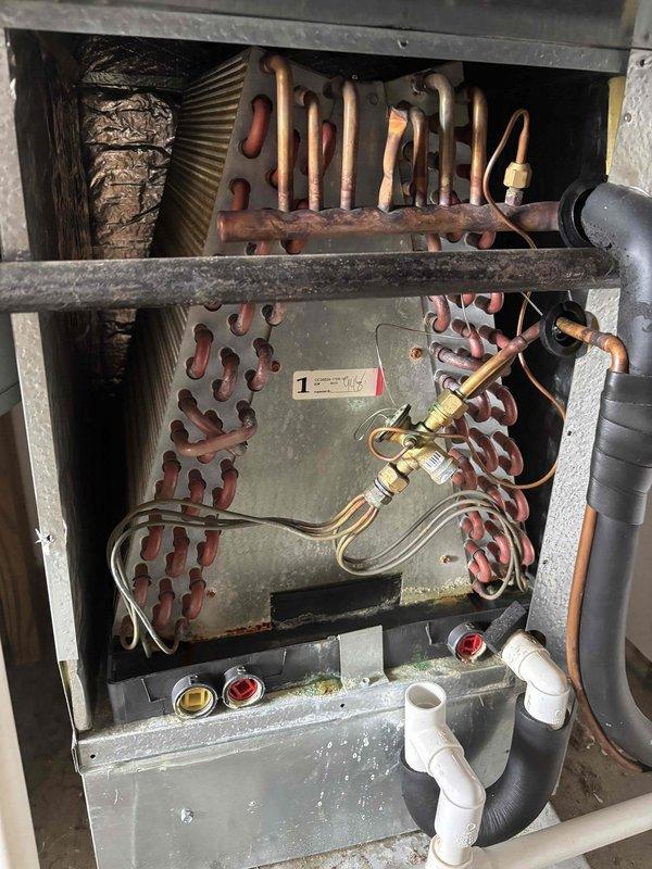Completed Platinum Level planned maintenance on a 6-year-old single-system HVAC unit during the second annual visit. Performed comprehensive inspection of all major components including the outdoor unit's electrical control panel, CoreSense diagnostic module, capacitor, and wiring connections. Examined the indoor air handler assembly, verifying proper operation of the heat exchanger coils, drainage system with PVC piping, and refrigerant line connections. Replaced 16x20x5 air filter as part of routine maintenance protocol. Documented system condition through photographic records showing electrical components, control systems, heat exchanger assembly with aged copper tubing exhibiting normal oxidation patterns, and drainage pan. All components found operating within normal parameters with no immediate service needs identified. System cleared for continued operation until next scheduled maintenance interval.