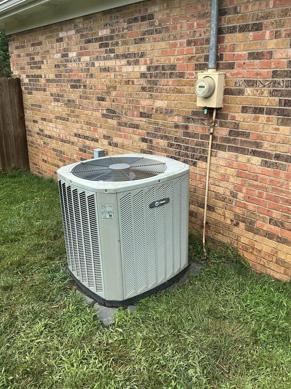 Responded to service call for reported furnace water leak with system still operational. Upon arrival, inspected outdoor Trane XB14 condenser unit (Model 4TTR3024A1000AA, manufactured November 2010) and found no active leaking at time of inspection. Unit appeared to be functioning normally with no visible water accumulation around base or on pad. Documented equipment condition with photos showing unit exterior, manufacturer specifications, and installation location. Advised customer to monitor system and contact for further diagnosis if leak recurs.