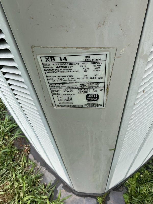 Responded to service call for reported furnace water leak with system still operational. Upon arrival, inspected outdoor Trane XB14 condenser unit (Model 4TTR3024A1000AA, manufactured November 2010) and found no active leaking at time of inspection. Unit appeared to be functioning normally with no visible water accumulation around base or on pad. Documented equipment condition with photos showing unit exterior, manufacturer specifications, and installation location. Advised customer to monitor system and contact for further diagnosis if leak recurs.
