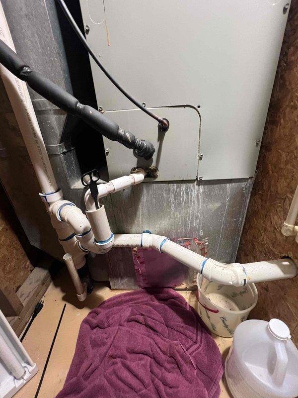 Responded to service call for 10-year-old heat pump system experiencing repeated freeze-up issues following previous refrigerant leak repair. Conducted comprehensive system evaluation and documented existing equipment configuration, including indoor air handler with upflow plenum arrangement and outdoor heat pump unit. Provided detailed replacement estimate for complete heat pump system to address ongoing reliability concerns and avoid continued repair costs on aging equipment.
