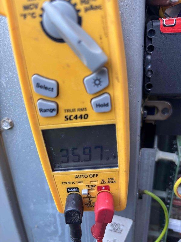 Completed second scheduled maintenance visit on a 6-year-old residential HVAC system under Gold Level maintenance plan with 20x25x5 filter specification. Performed comprehensive electrical diagnostics using calibrated digital multimeter, verifying voltage readings and system performance at the control panel and terminal connections. Conducted exterior condenser unit inspection, confirmed proper installation with adequate clearance, verified landscaping integration with river rock base and protective edging maintained appropriate distance from unit for airflow optimization.