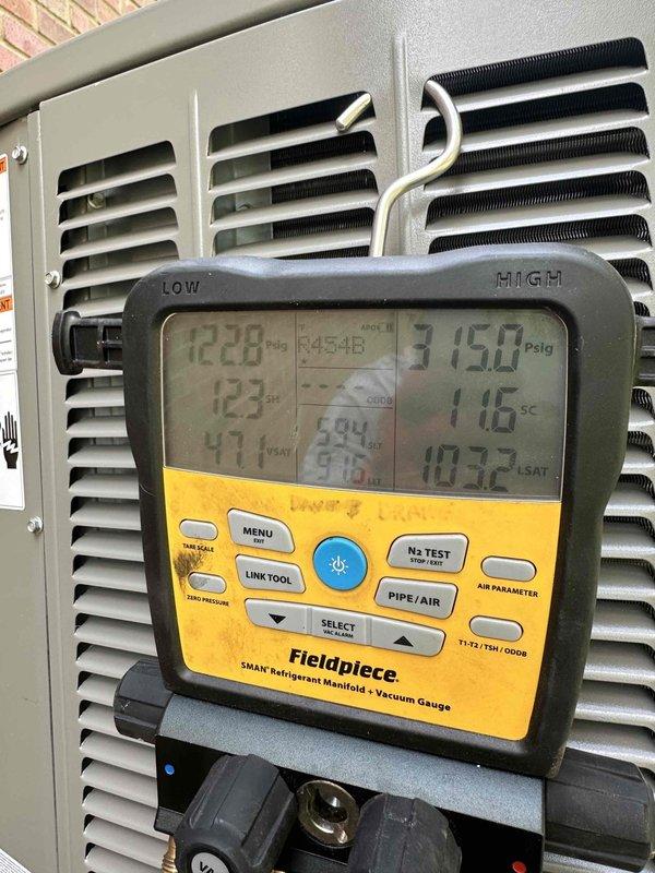 Completed installation of a 5-ton, 18 SEER Lennox upflow furnace system with i-Harmony communicating zoning technology in basement mechanical room. System was properly commissioned with refrigerant manifold gauges confirming optimal pressures and temperatures, all ductwork connections secured, and communicating controls verified for multi-zone operation.