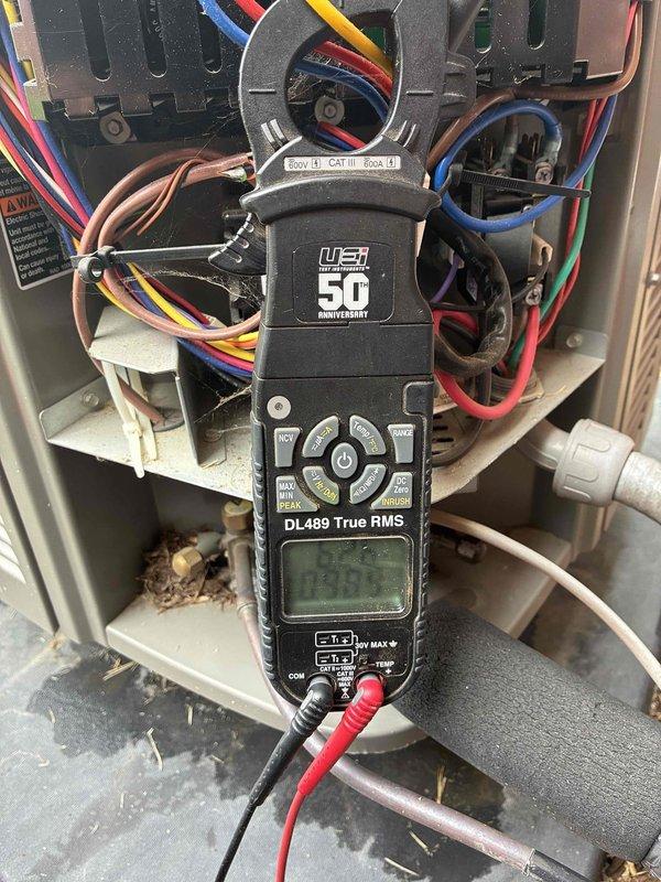 Completed scheduled HVAC maintenance tune-up with no reported issues. Performed comprehensive system diagnostics including electrical testing of control panel connections using digital multimeter, verified proper wire terminations and voltage readings across all circuits. Inspected ductwork system and observed normal wear on flexible aluminum ducting, confirmed PVC condensate drain line positioning and thermostat operation with proper display function.