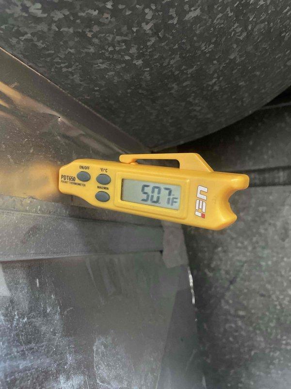 Responded to callback for condensation issue on recently installed furnace system. Upon arrival, verified unit was operational for both heating and cooling functions. Conducted temperature diagnostics using digital thermometer at multiple points on ductwork and air handling components, recording supply air temperatures of 58.7°F and 50.7°F at different locations. Inspected condensate drainage system, drain lines, and trap assembly for proper installation and function. System remains functional pending customer's rescheduled appointment for further evaluation and resolution of condensation concern.