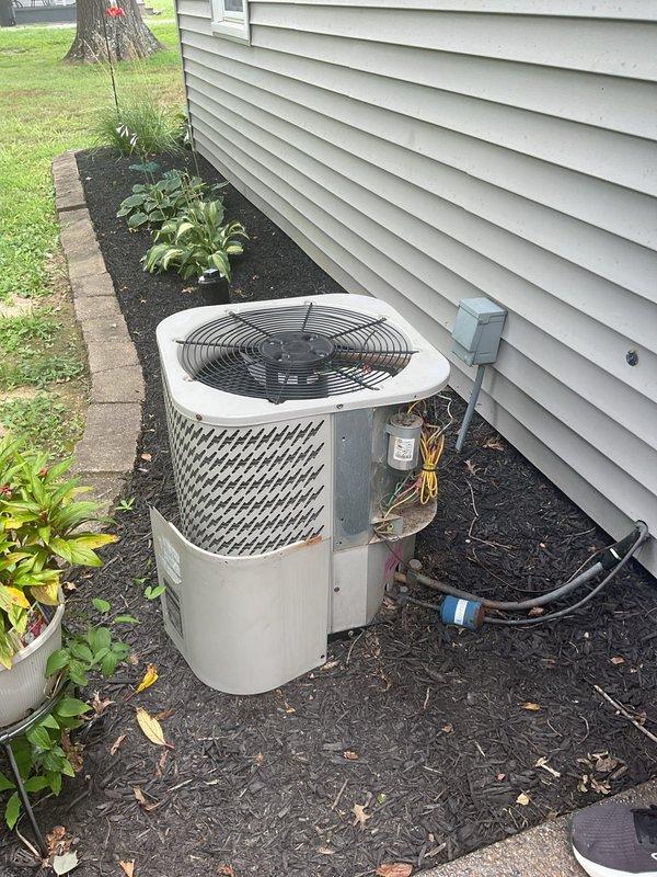 Completed comprehensive HVAC replacement estimate for non-operational residential system. Evaluated existing outdoor condenser unit with cylindrical configuration and beige housing positioned against exterior wall with electrical disconnect and refrigerant line connections, as well as indoor furnace equipment including blower assembly and control components. Provided homeowner with detailed replacement options and specifications for complete system upgrade.