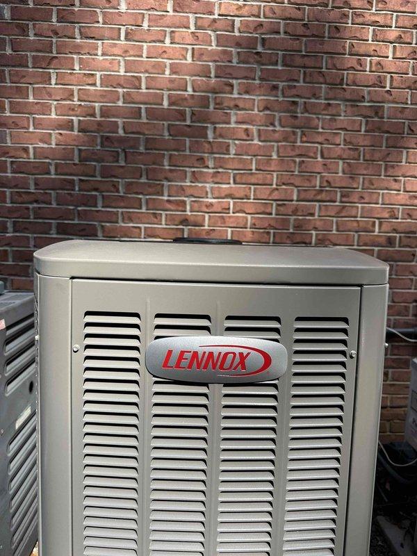 Completed full HVAC system installation including 4-ton, 18 SEER Lennox heat pump outdoor unit and matching indoor air handler with ProLine water heater integration. Installed outdoor condenser unit against exterior brick wall with proper clearance and positioning for optimal airflow and service access. Mounted indoor air handler in utility closet with complete ductwork connections utilizing black flexible duct transitions. Integrated white PVC condensate drain piping and venting system per manufacturer specifications. Connected all refrigerant lines between outdoor and indoor units with proper insulation and secure mounting. Installed and wired all electrical connections for both heating and cooling operations. Positioned and plumbed A.C. Smith ProLine water heater with copper supply lines, expansion tank, and appropriate safety devices. Verified all manufacturer labels, warning stickers, and technical specification plates properly displayed on equipment. Tested complete system operat