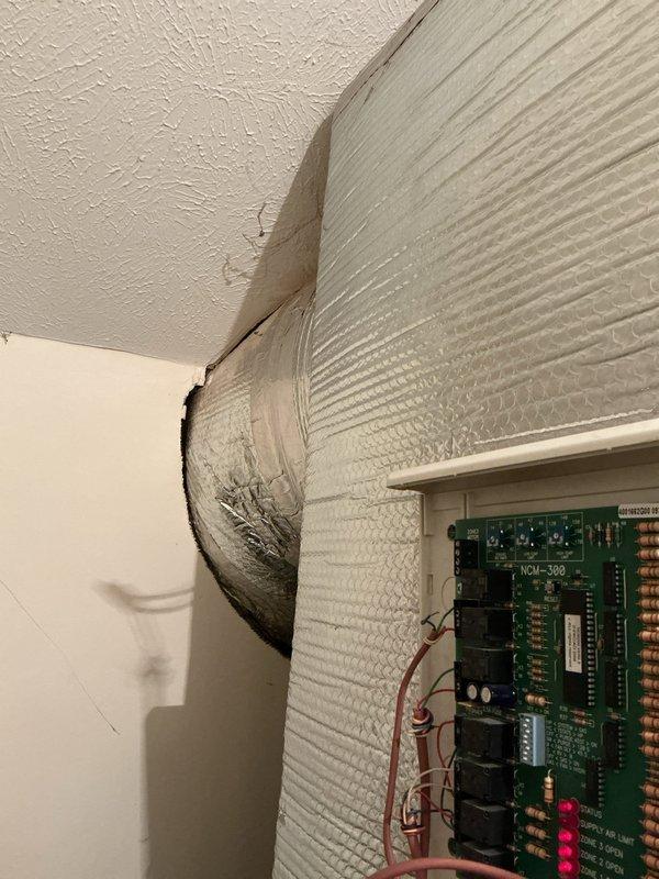 Conducted comprehensive assessment of existing HVAC system for replacement estimate. Documented current installation consisting of air handler unit and furnace system utilizing R-410A refrigerant in utility closet configuration. Evaluated equipment positioning, ductwork connections including flexible aluminum ducting at ceiling penetration, refrigerant line routing with black insulation, copper tubing connections, and yellow flexible gas line installation. Photographed electrical control board (HOM-300) and all mechanical components to provide accurate replacement specifications and system upgrade recommendations for Green A+ efficiency rating equipment.