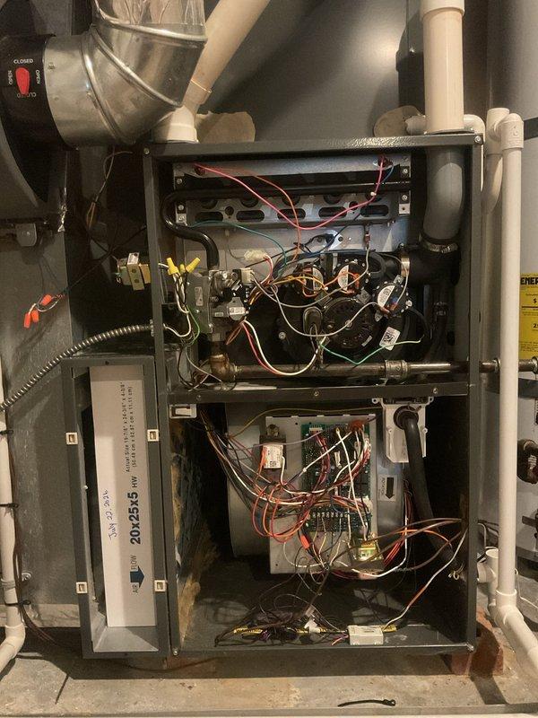 Completed comprehensive preventive maintenance on an eight-year-old residential air conditioning system currently operating within normal parameters. Performed full AC tune-up including inspection of furnace and HVAC components housed in utility closet, verified all electrical connections and wiring configurations across upper and lower compartments, checked condensate drainage system and PVC piping for proper operation, and documented equipment condition through photographic records. All mechanical components, control mechanisms, and ductwork connections were inspected and found to be functioning properly with no immediate service needs identified.