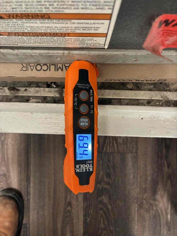 Responded to emergency water leak originating from HVAC ductwork in upstairs unit penetrating through ceiling into downstairs apartment. Upon arrival, found significant water damage with active condensation drip from supply duct causing ceiling deterioration, discoloration, and mold growth. Inspected HVAC system and confirmed duct insulation failure allowing condensate formation on cold supply line. Measured supply air temperature at 47°F, confirming proper cooling operation but inadequate vapor barrier on ductwork. Repaired compromised duct insulation, sealed all penetrations, and verified no further condensation occurring. Documented water-damaged ceiling areas requiring remediation by property maintenance.