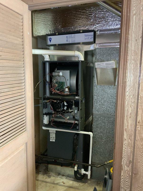 Performed comprehensive planned maintenance service on a 4-5 year old residential air conditioning system following customer report from another technician indicating the unit required cleaning. Accessed HVAC system located in utility closet and removed access panels to inspect internal components. Conducted thorough visual inspection of control board, wiring harnesses, blower motor assembly, and all electrical connections. Cleaned evaporator coil and blower components to remove accumulated dirt and debris affecting system efficiency. Inspected condensate drain lines and PVC piping connections for proper operation. Verified all wire connections were secure and properly terminated at control board and motor assemblies. Checked blower motor operation and mounting integrity. Inspected air filtration system mounted above main unit. Tested all safety controls and electrical components for proper function. System restored to normal operation with improved airflow and efficiency following cle