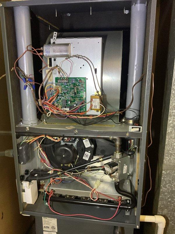 Performed comprehensive planned maintenance service on a 4-5 year old residential air conditioning system following customer report from another technician indicating the unit required cleaning. Accessed HVAC system located in utility closet and removed access panels to inspect internal components. Conducted thorough visual inspection of control board, wiring harnesses, blower motor assembly, and all electrical connections. Cleaned evaporator coil and blower components to remove accumulated dirt and debris affecting system efficiency. Inspected condensate drain lines and PVC piping connections for proper operation. Verified all wire connections were secure and properly terminated at control board and motor assemblies. Checked blower motor operation and mounting integrity. Inspected air filtration system mounted above main unit. Tested all safety controls and electrical components for proper function. System restored to normal operation with improved airflow and efficiency following cle