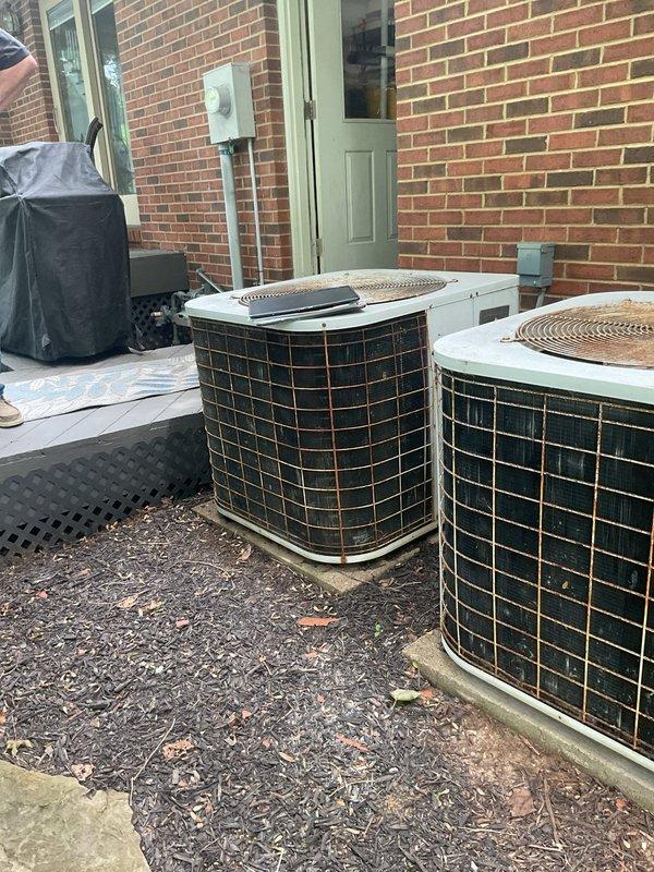 Completed comprehensive replacement estimate for dual HVAC system consisting of two outdoor condenser units and indoor Tempstar furnace. Both outdoor units showed significant weathering and age-related deterioration on exterior grilles and casings, positioned on concrete pad in exterior patio area. Indoor furnace unit located in basement utility space with existing ductwork configuration assessed for compatibility with replacement equipment.
