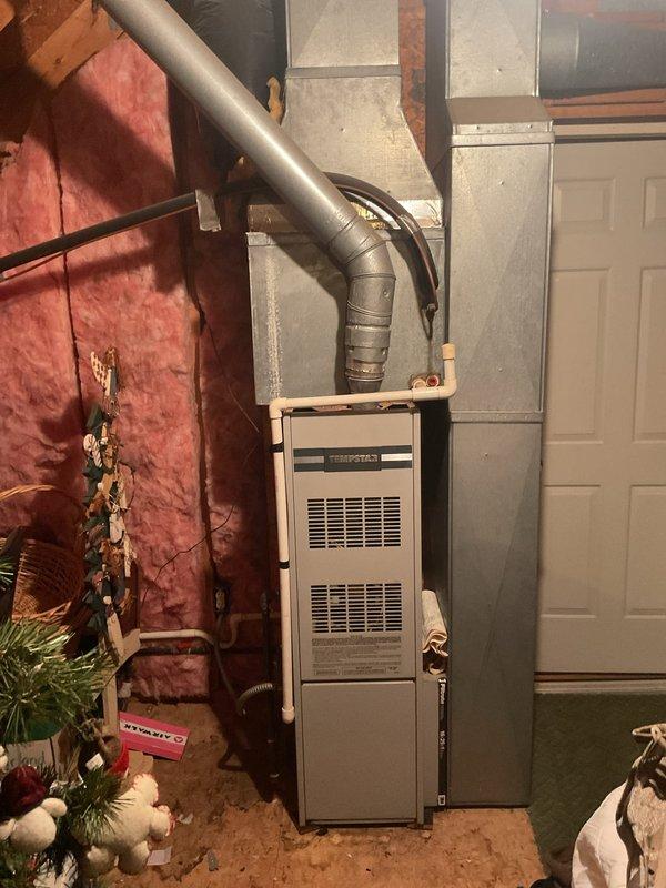 Completed comprehensive replacement estimate for dual HVAC system consisting of two outdoor condenser units and indoor Tempstar furnace. Both outdoor units showed significant weathering and age-related deterioration on exterior grilles and casings, positioned on concrete pad in exterior patio area. Indoor furnace unit located in basement utility space with existing ductwork configuration assessed for compatibility with replacement equipment.