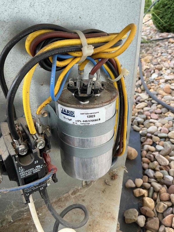 Completed planned maintenance on 6-year-old air conditioning system with 16x25x5 filter specification. Performed comprehensive system inspection including electrical component evaluation, with particular attention to the outdoor unit's capacitor and contactor assembly. Verified capacitor specifications and connections, confirming proper wire terminations with secure zip-tie bundling. Utilized digital clamp meter to obtain diagnostic readings, measuring 86.2 on system parameters to ensure equipment operating within manufacturer specifications. All electrical connections found secure, components showing normal wear consistent with age and outdoor exposure, system functioning properly upon completion of maintenance protocol.