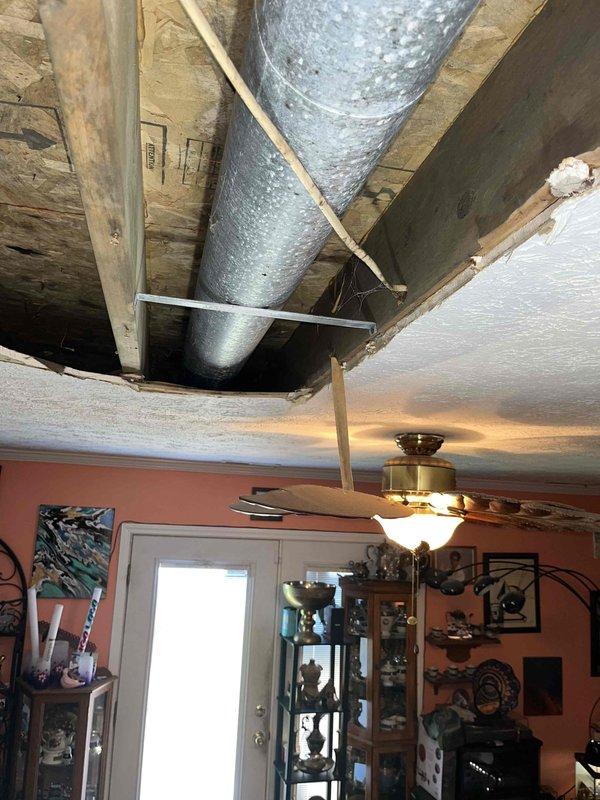 Completed estimate for HVAC ductwork replacement project involving conversion from existing rigid pipe to flexible duct system. Accessed attic space through ceiling opening to assess current ductwork configuration, which included aged metal ductwork with reflective insulation secured by metal strapping to wooden joists. Evaluated structural conditions, existing duct routing, and installation requirements for proposed flex duct replacement to ensure proper airflow and system efficiency.
