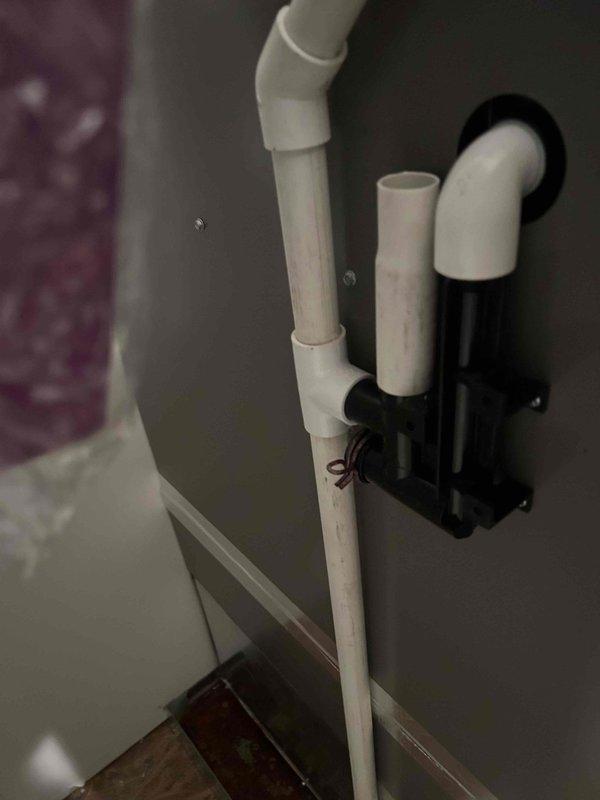 Responded to no cooling complaint on 2-year-old upstairs Lennox air handler. Upon inspection, found condensate drain pan flooded with standing water, causing float switch to activate and shut down system. Thermostat displayed 82°F with setpoint at 78°F. Diagnosed clogged condensate drain line preventing proper drainage. Cleared accessible portion of drain line and verified float switch operation. System requires proper Lennox drain trap component for complete repair to ensure proper condensate evacuation and prevent future shutdowns. Scheduled return visit with correct Lennox drain trap assembly to complete installation and restore full system operation.