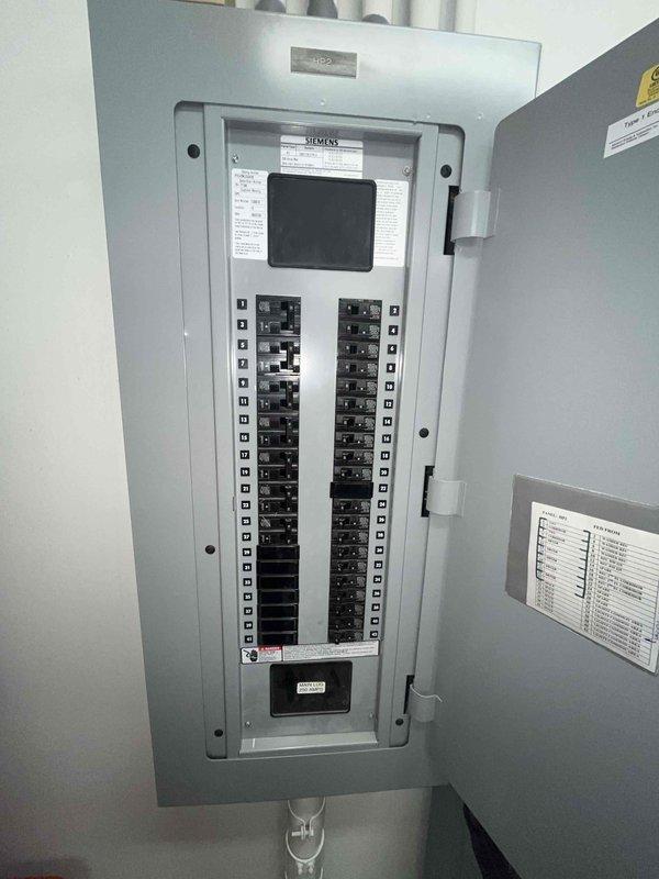 Conducted comprehensive replacement estimate for five aging split system HVAC units approximately 22 years old, including four 3-phase units and one single-phase unit. Assessed existing Trane air handler installations (Units 5 and 6 documented) in mechanical room with associated ductwork, drainage systems, and electrical infrastructure. Evaluated electrical panel configuration and power requirements to determine compatibility for new equipment installation and verified existing 3-phase and single-phase service capabilities for proper system replacement planning.