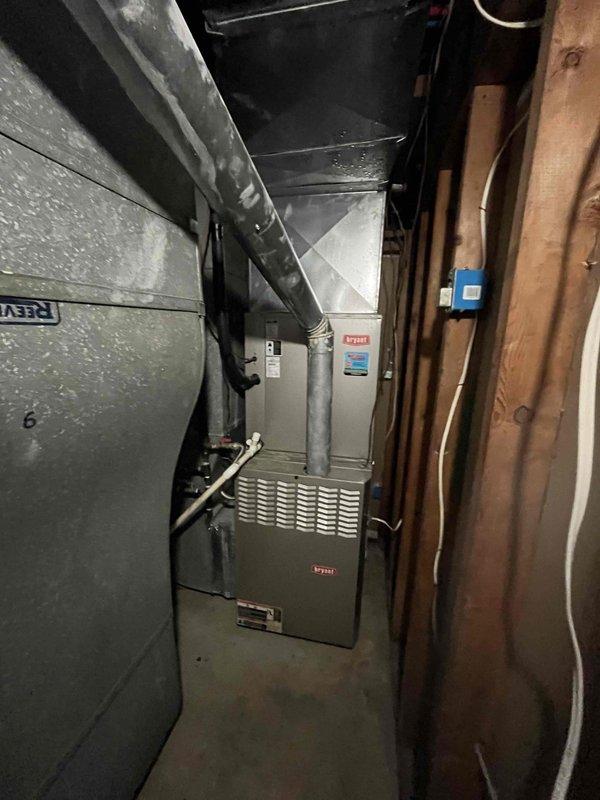 Completed planned duo maintenance on two 12-year-old HVAC systems. Performed comprehensive inspection of both furnace units located in basement utility area, checked all operational components, replaced air filters, and verified proper ductwork connections. Noted moisture condensation present on metal ductwork, which is normal for the environmental conditions. Both systems operating within manufacturer specifications with all safety controls functioning properly.