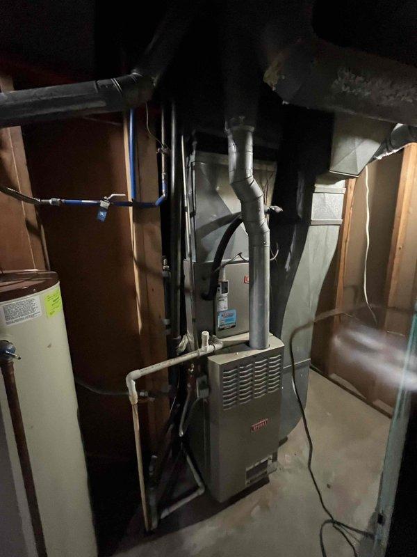 Completed planned duo maintenance on two 12-year-old HVAC systems. Performed comprehensive inspection of both furnace units located in basement utility area, checked all operational components, replaced air filters, and verified proper ductwork connections. Noted moisture condensation present on metal ductwork, which is normal for the environmental conditions. Both systems operating within manufacturer specifications with all safety controls functioning properly.